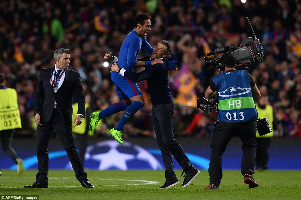 Neymar leaps into his manager Luis Enriques arms after Barca reached the quarter-finals in dramatic style