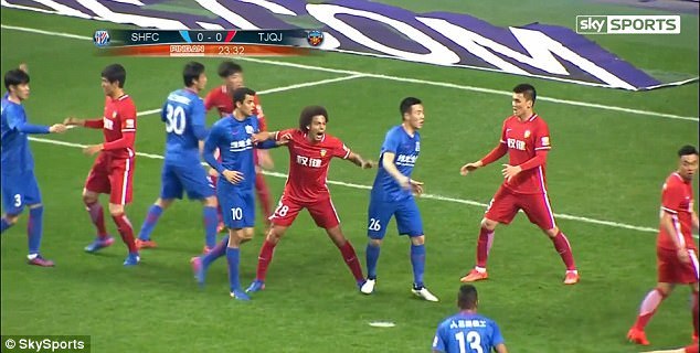 Witsel lets out a cry of pain and tumbles to the ground after being stamped on by Qin
